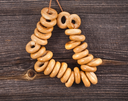 sheaf bagels on old ancient wood texture backgroundの写真素材