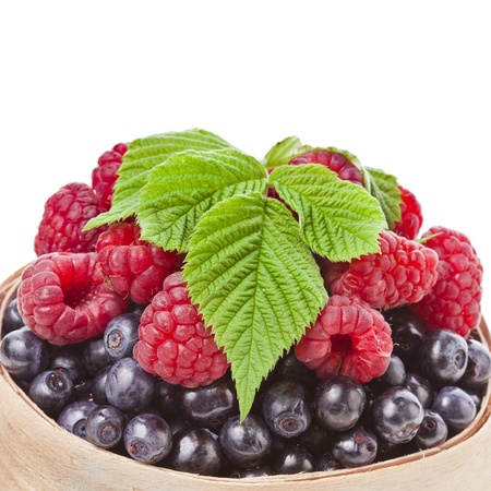 blueberries , raspberries isolated on a white background