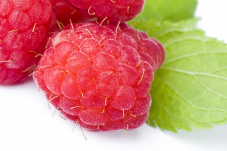 raspberries close up macro isolated on a white backgroundの写真素材