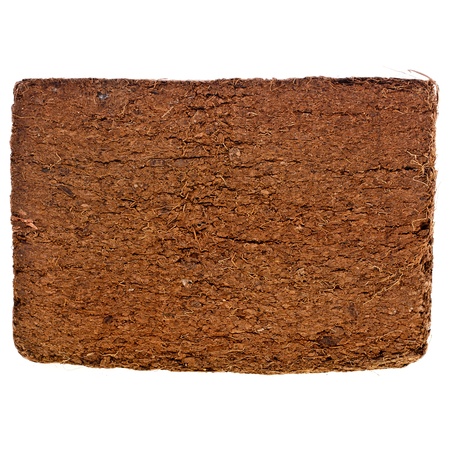 A compressed bale of ground coconut shell fibers  coir , surface backgroundの写真素材