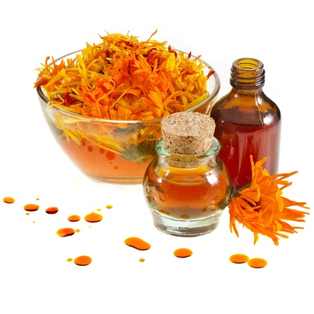 herbal calendula in the glass and aromatherapy essential oil Isolated white backgroundの写真素材