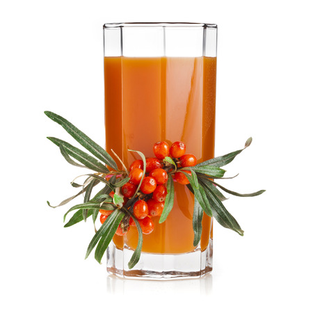 sea buckthorn berries juice on the glassful isolated on white backgroundの写真素材