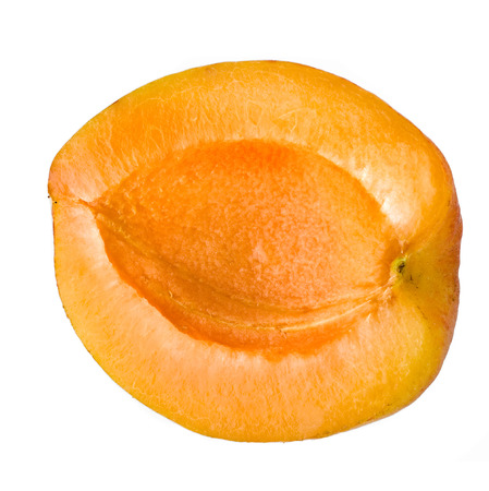 fresh apricot fruits cut isolated on white backgroundの写真素材