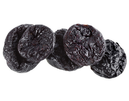 dries plums or prunes fruit isolated on white backgroundの写真素材