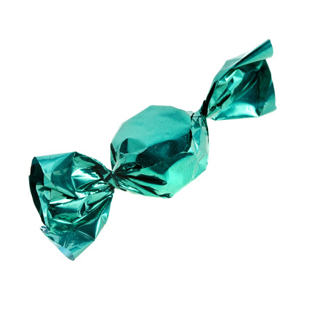 candy in green wrapper isolated on white backgroundの写真素材