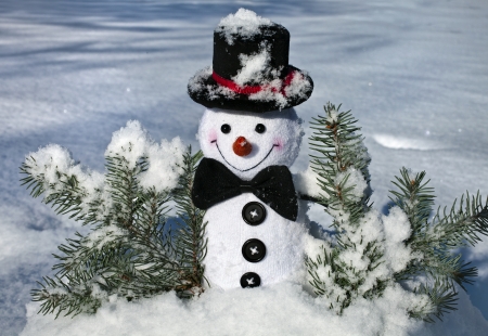 Happy Cheerful Christmas snowman in snow outdoors backgroundの写真素材