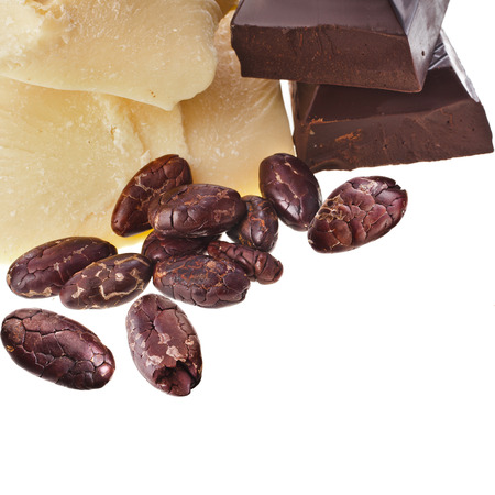 cocoa butter , chocolate pieces and beans heap close up isolated on white backgroundの写真素材