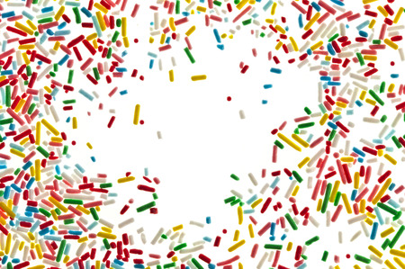 Border frame of colorful candy sprinkles isolated on white card for textの写真素材