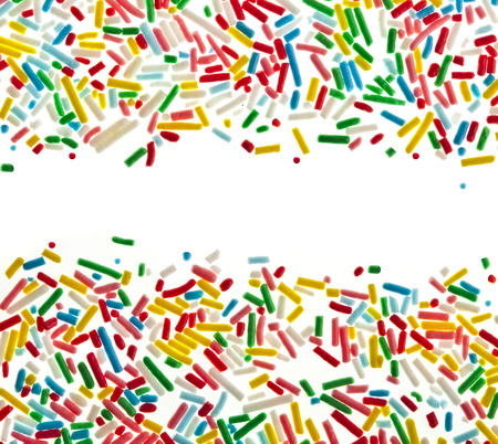 Border frame of colorful candy sprinkles isolated on white card for textの写真素材