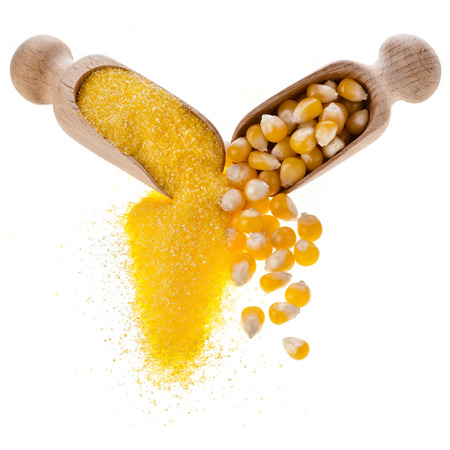 cornmeal maize flour heap and wooden scoop isolated on white の写真素材