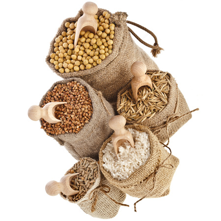 Corn kernel seed meal and grains in bags top view isolated on a white backgroundの写真素材