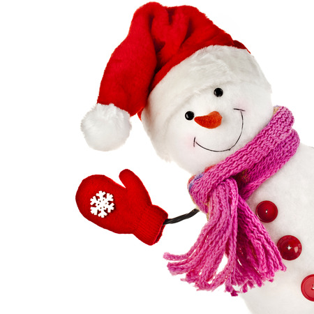 happy snowman in knitted hat and scarf and mittens isolated on white backgroundの写真素材