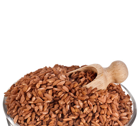 Brown Rice Heap Close up Macro isolated on White Backgroundの写真素材