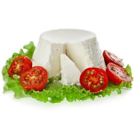 Ricotta Cheese in the lettuce leaves and tomato isolated on white backgroundの写真素材