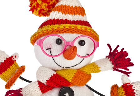 happy snowman spectacled in knitted hat and scarf close up isolated on white backgroundの写真素材