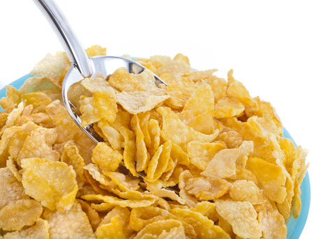 corn flakes in bowl isolated on the white backgoundの写真素材