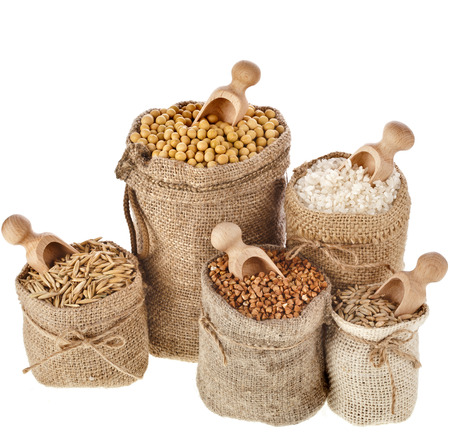 Corn kernel seed meal and grains in bags collection isolated on a white backgroundの写真素材