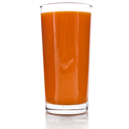 glass of carrot juice and fresh carrots grated isolated on white backgroundの写真素材