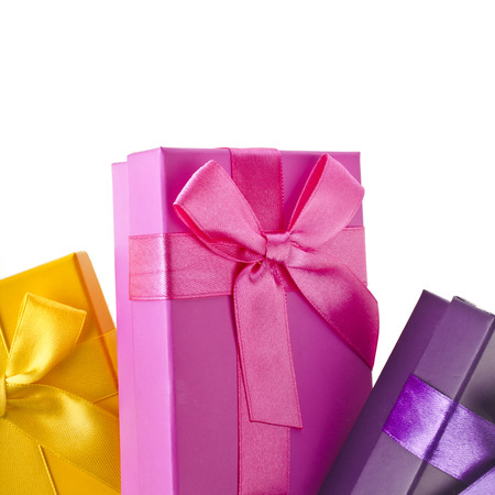 colorful gift boxes wrapped ribbon bows isolated on white backgroundの写真素材