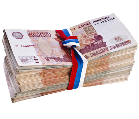 Heap of One Million Banknotes Rubles of the Russian Federation wrapping Ribbon flag tape - isolated on white backgroundの写真素材