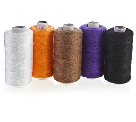 Colorful bobbin thread set isolated on white backgroundの写真素材