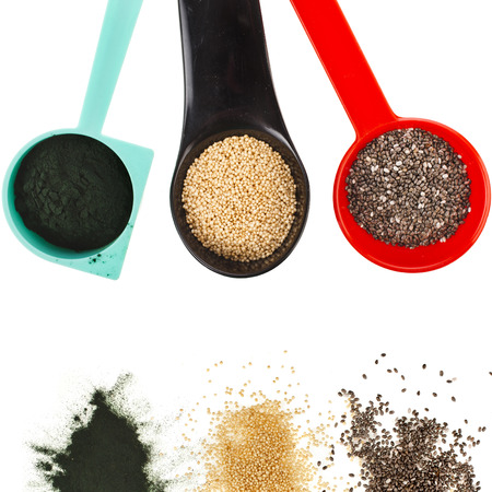 superfoods heap pile collection close up in colorful scoop top view surface isolated on white backgroundの写真素材