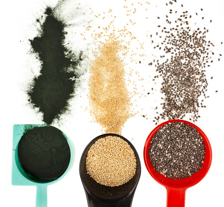 superfoods heap pile collection close up in colorful scoop top view surface isolated on white backgroundの写真素材