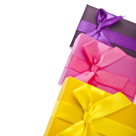 many colorful gift boxes wrapped ribbon bows isolated on white backgroundの写真素材