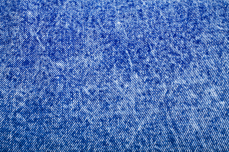 Background texture of the rough blue jean denimの写真素材