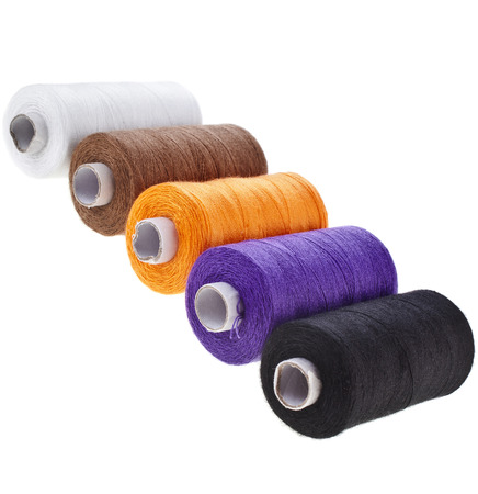Colorful bobbin thread set isolated on white backgroundの写真素材