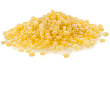 Israeli couscous pile  Ptitim  close up isolated on white backgroundの写真素材