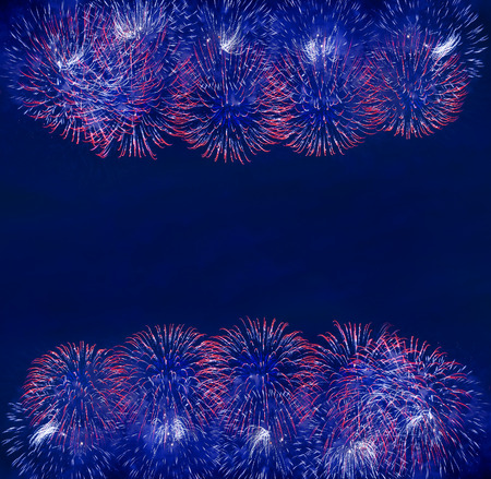 border frame of fireworks of various colors over night skyの写真素材