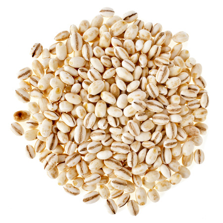 Pearl Barley Heap top view surface close up macro isolated on white Backgroundの写真素材