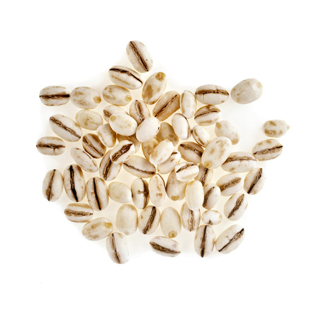 Pearl Barley Heap top view surface close up macro isolated on white Backgroundの写真素材