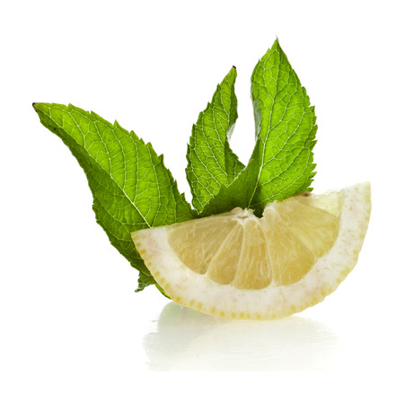 Fresh lemon with mint leaf isolated on white backgroundの写真素材