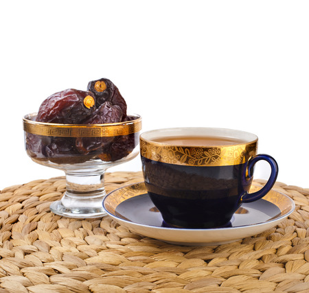Ramadan eastern refreshment drink with dates on table placemat isolated on a white backgroundの写真素材