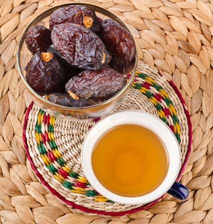 Ramadan eastern refreshment drink with dates on table placemat , top viewの写真素材