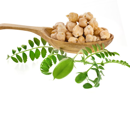 Chick peas over wooden spoon isolated on white backgroundの写真素材