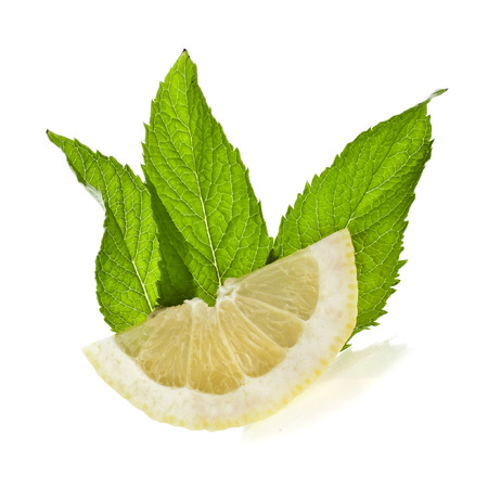 Fresh lemon with mint leaf isolated on white backgroundの写真素材