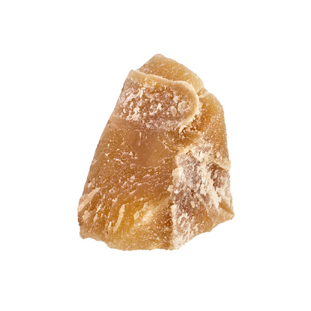 One piece of Beeswax close up isolated on a white backgroundの写真素材