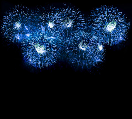 Blue colorful fireworks on the black sky backgroundの写真素材