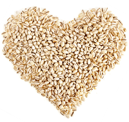 pearl barley shape heart close up surface top view backgroundの写真素材