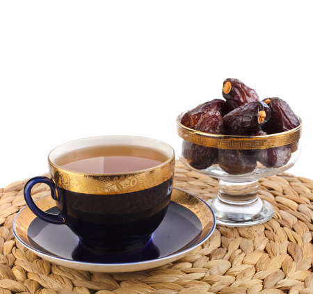 Ramadan eastern refreshment drink with dates on table placemat isolated on a white backgroundの写真素材