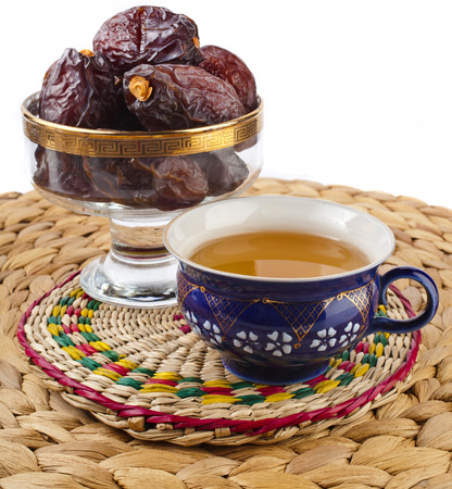 Ramadan eastern refreshment drink with dates on table placemat isolated on a white backgroundの写真素材