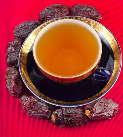 Black coffee with dates - a middle eastern refreshment drinkの写真素材