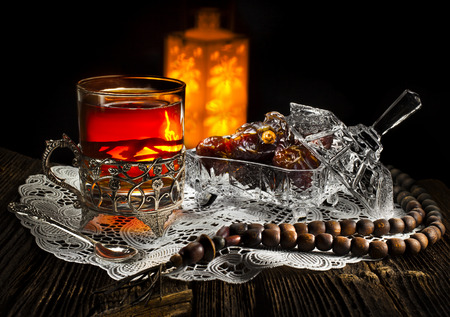 Ramadan lamp and dates still life on black backgroundの写真素材