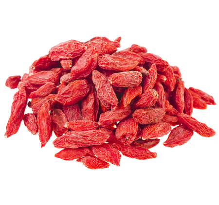 Heap pile of Goji berries. The addition to the tea beverage isolated on white backgroundの写真素材
