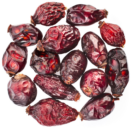 Heap pile of Dry RoseHip fruit , top view surface isolated on white backgroundの写真素材