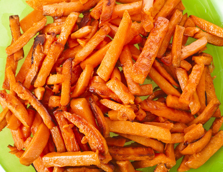 Fried Sweet Potatoes in plate top view surface close up background