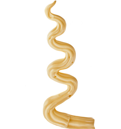 Zig-zag of cheese sauce decoration isolated on white backgroundの写真素材